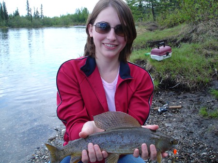My Beautiful Wife with a nice Arctic Grayling caught while fishing in Alaska